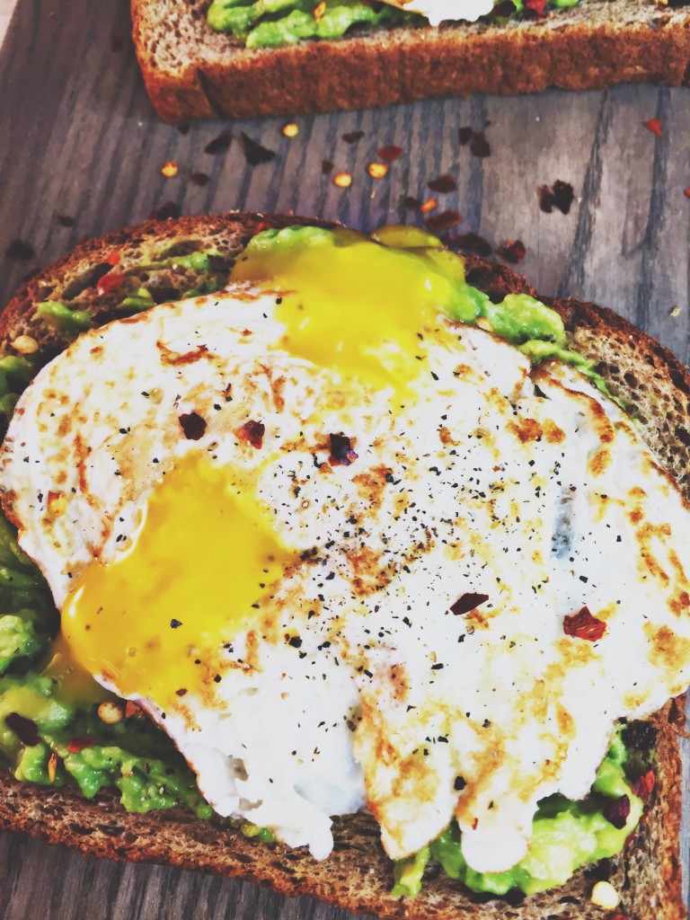 delicious avocado toast with sunny side up egg